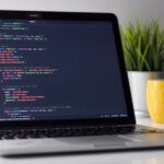 Laptop displaying code for software development
