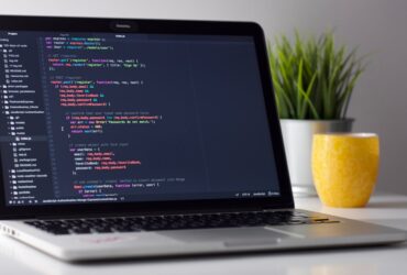 Laptop displaying code for software development