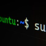 Laptop screen displaying code in a dark programming environment
