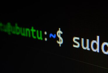 Laptop screen displaying code in a dark programming environment