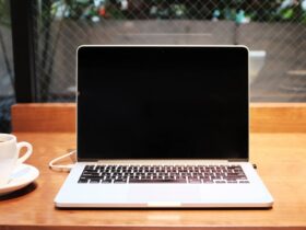 Person comparing laptops to choose the right specifications for their needs