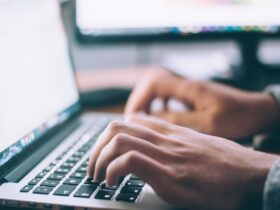 Person working on a laptop representing tech customer support experience