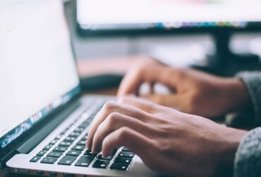 Person working on a laptop representing tech customer support experience
