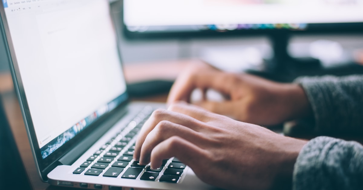 Person working on a laptop representing tech customer support experience