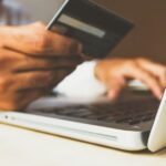 Credit card and smartphone representing tech subscription payment management