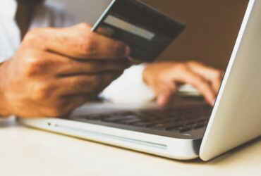 Credit card and smartphone representing tech subscription payment management