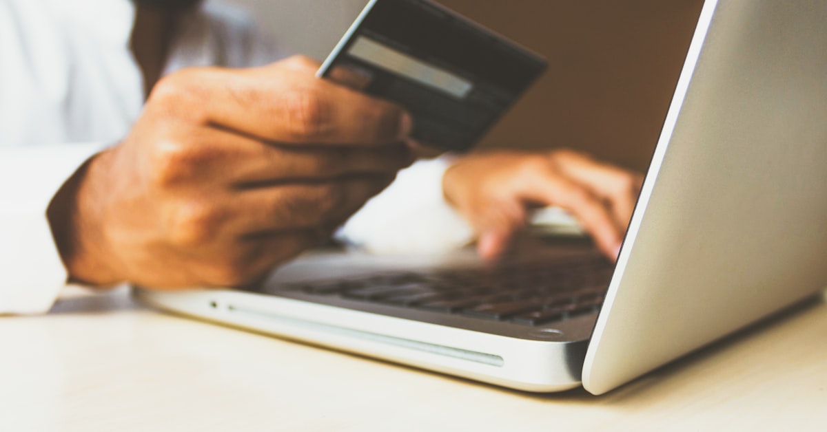 Credit card and smartphone representing tech subscription payment management